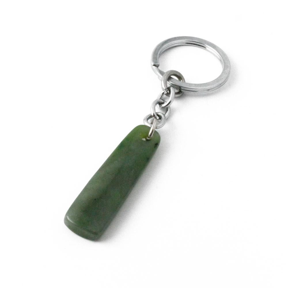 Jade keychain pendant with a silver chain and ring on a white backdrop.