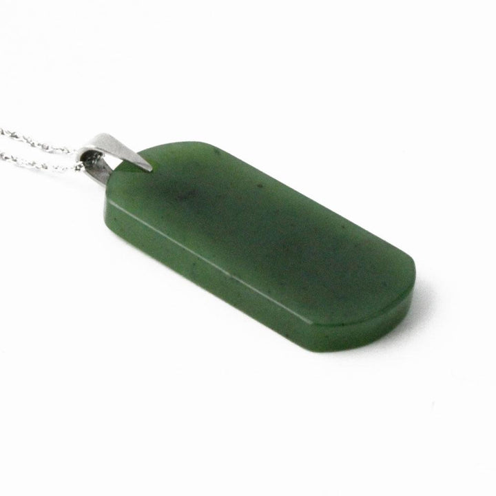 Dark green rectangular dog tag pendant with a circular hole near the bottom right, attached to a silver chain.
