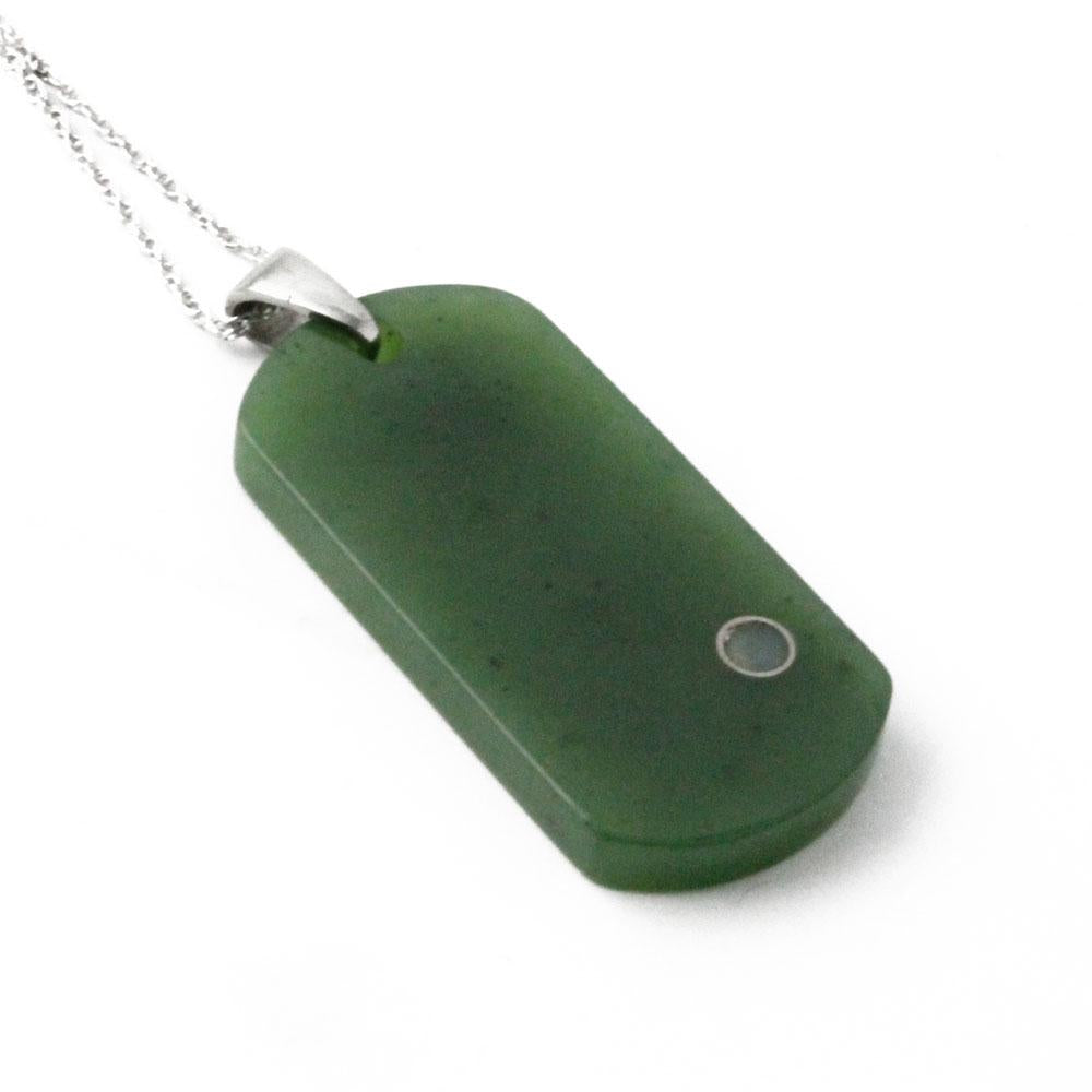 Green rectangular dog tag pendant shown at an angle with a small circular dot near the lower right.