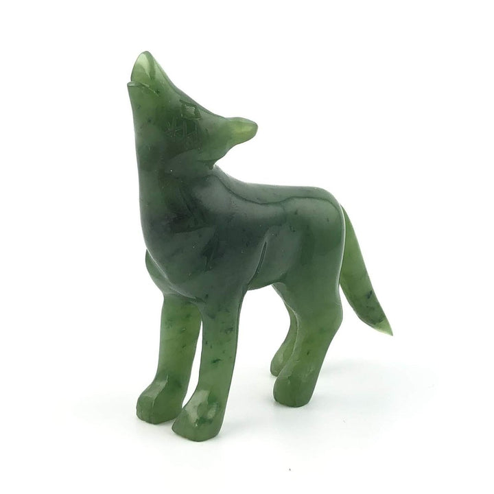 Green marbleized coyote figurine shown in side profile.