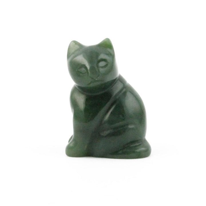 Dark green cat figurine sitting