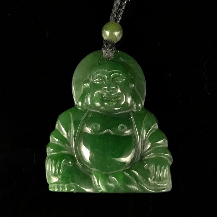 Green jade Laughing Buddha pendant on a black cord with a small green bead above.