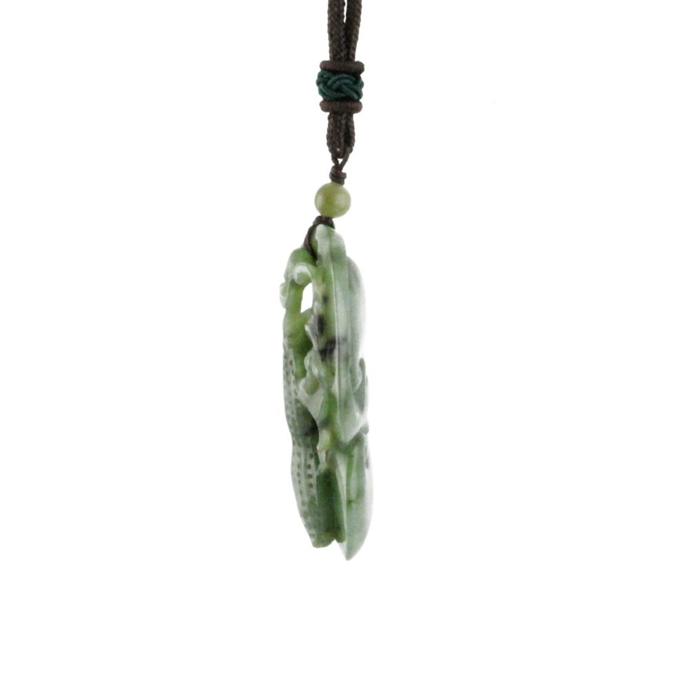 Two tone jade peanut pendant hanging from brown cord with a small bead above