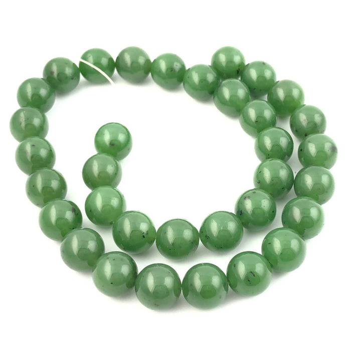 Circular strand of green 12mm beads with a visible thread on a white background