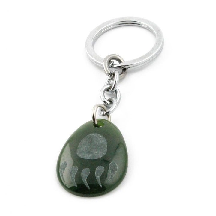 Green Bear Paw keychain charm hanging from a silver keyring
