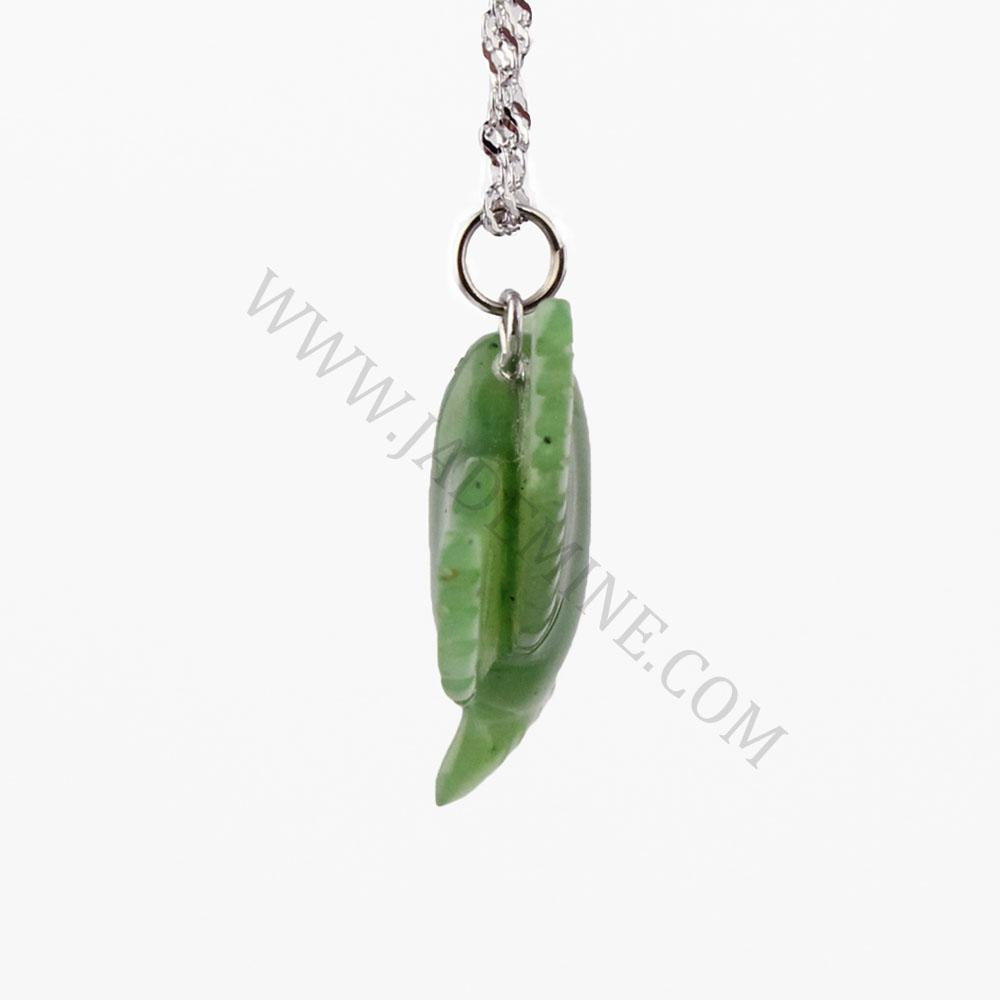 Green jade hummingbird pendant hanging from a silver ring on a chain