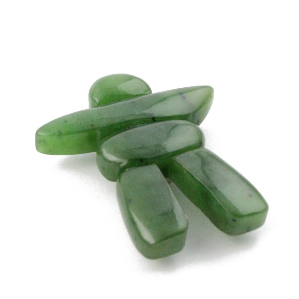 Green inukshuk shaped magnet pieces arranged in a cluster.