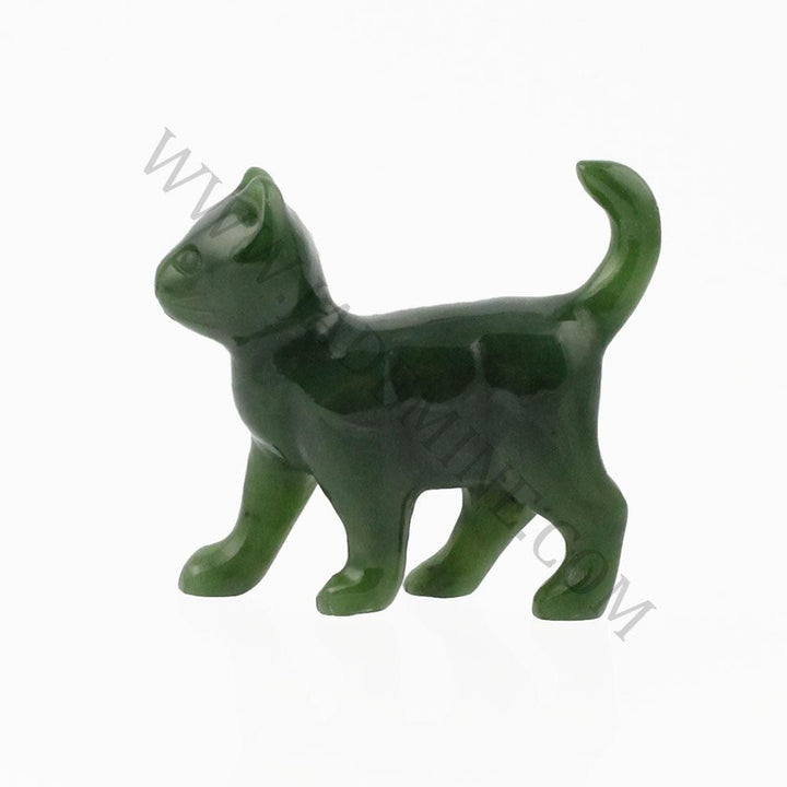 Green cat figurine in side profile walking with tail curved upward