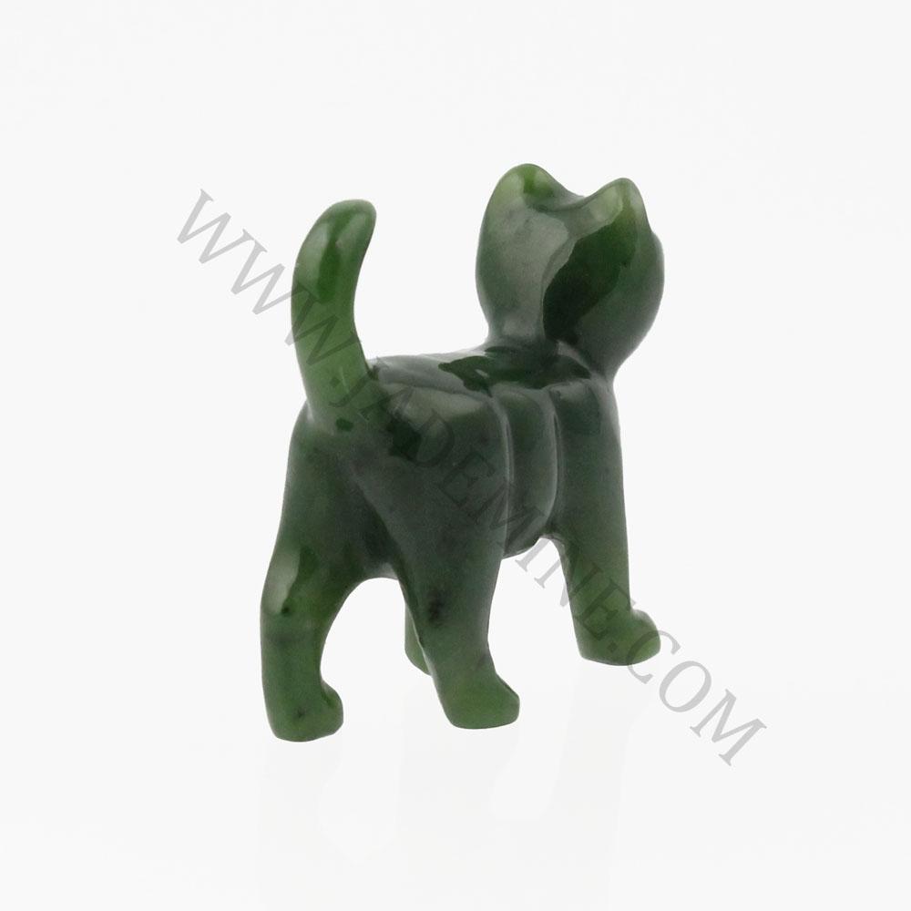Dark green jade cat figurine seen from behind with tail held high.