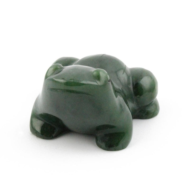 Back view of two glossy dark green frog figurines
