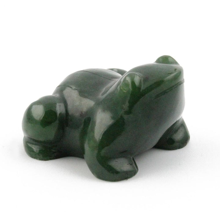 Green jade frog against a white background