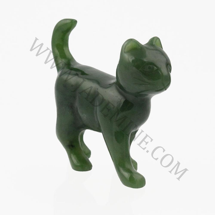 Small dark green cat figurine in a walking pose