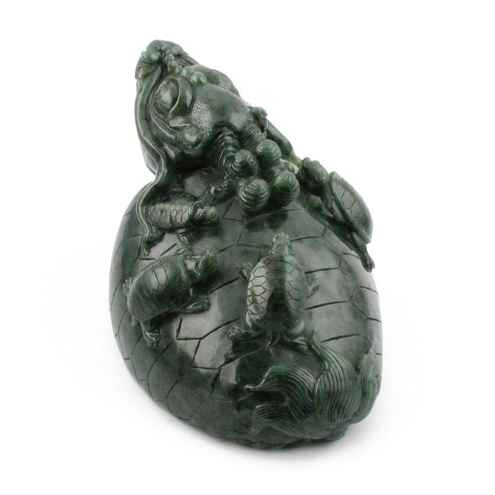 Dark green jade dragon turtle carving with a dragon atop a textured turtle shell