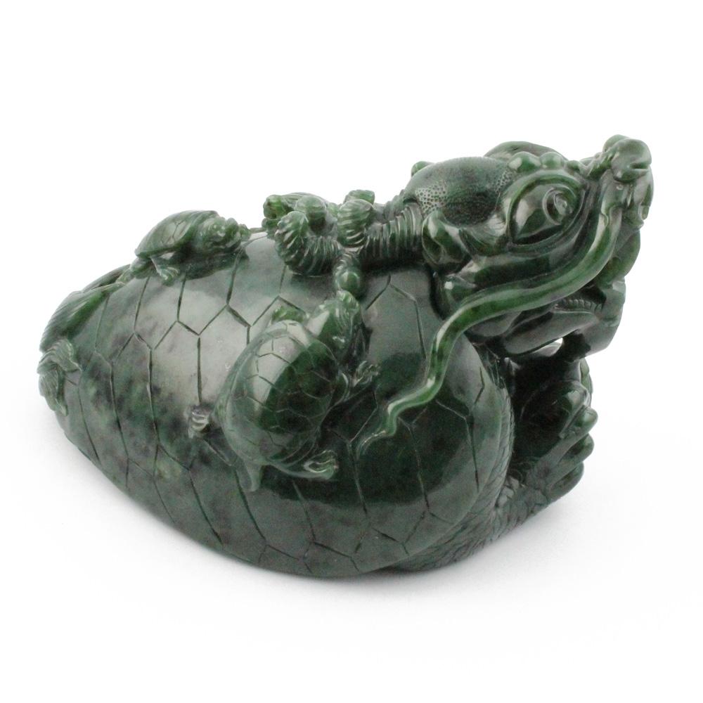 Side angle of jade dragon turtle highlighting the carved dragon and shell pattern