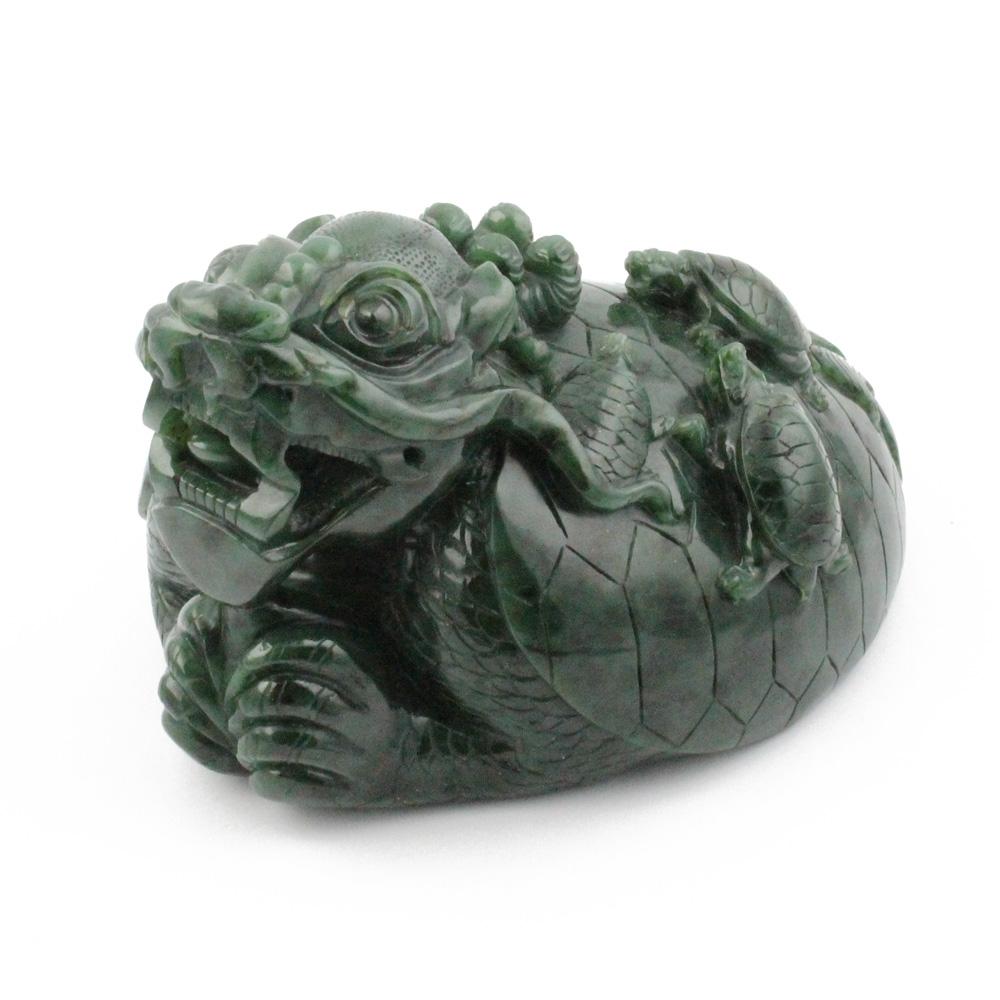 Side view of a dark green jade dragon turtle sculpture showing the head and curled body