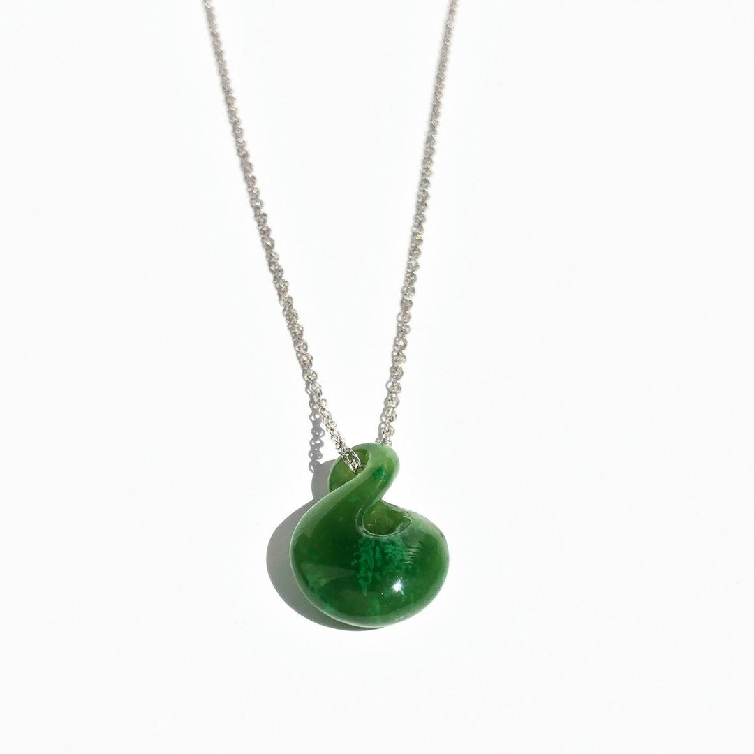 Green jade infinity twist pendant on a silver chain