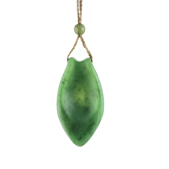 Green Jade Pendant on a beige cord, with a jade bead on top. White background