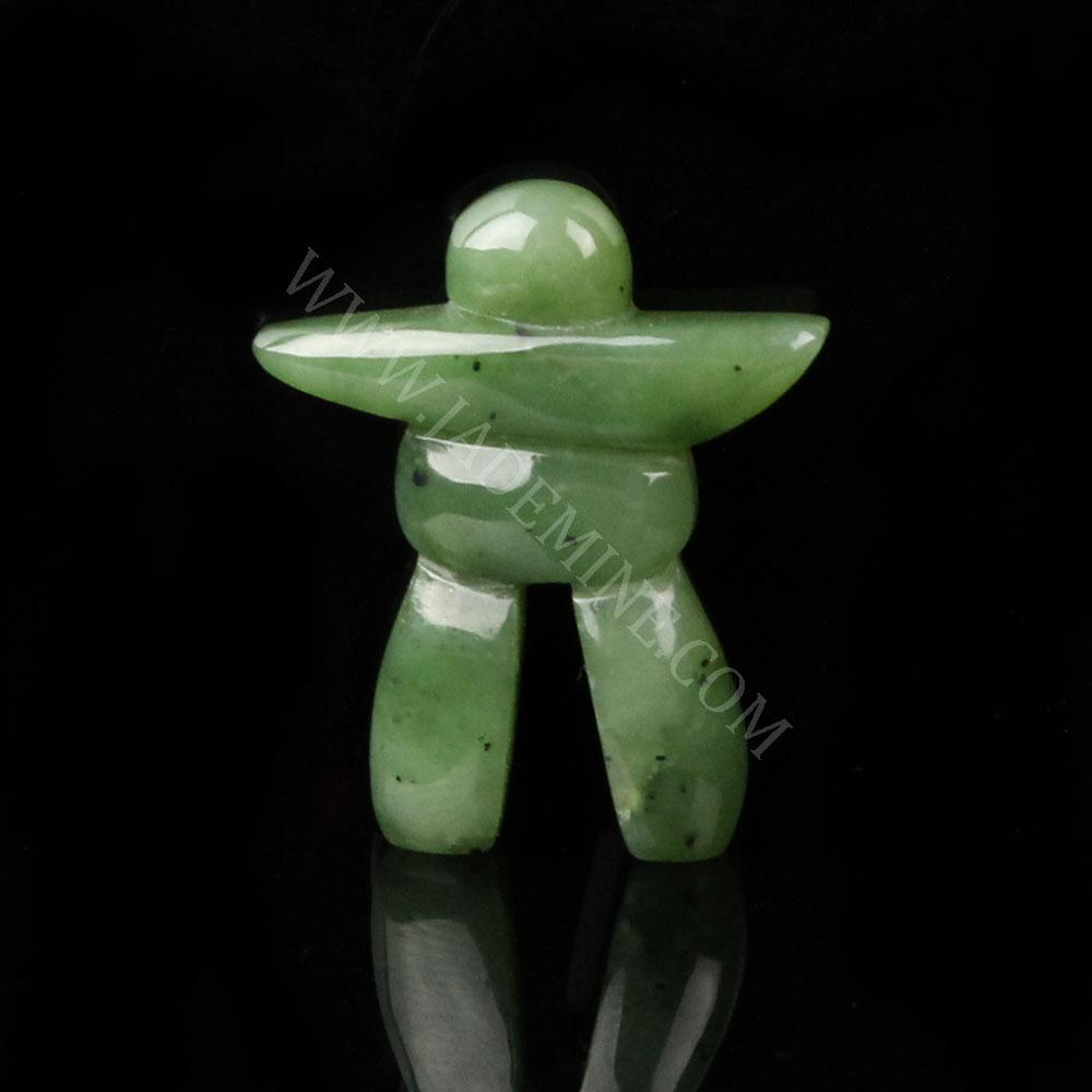 Green jade Inukshuk sculpture with arms outstretched and two legs standing