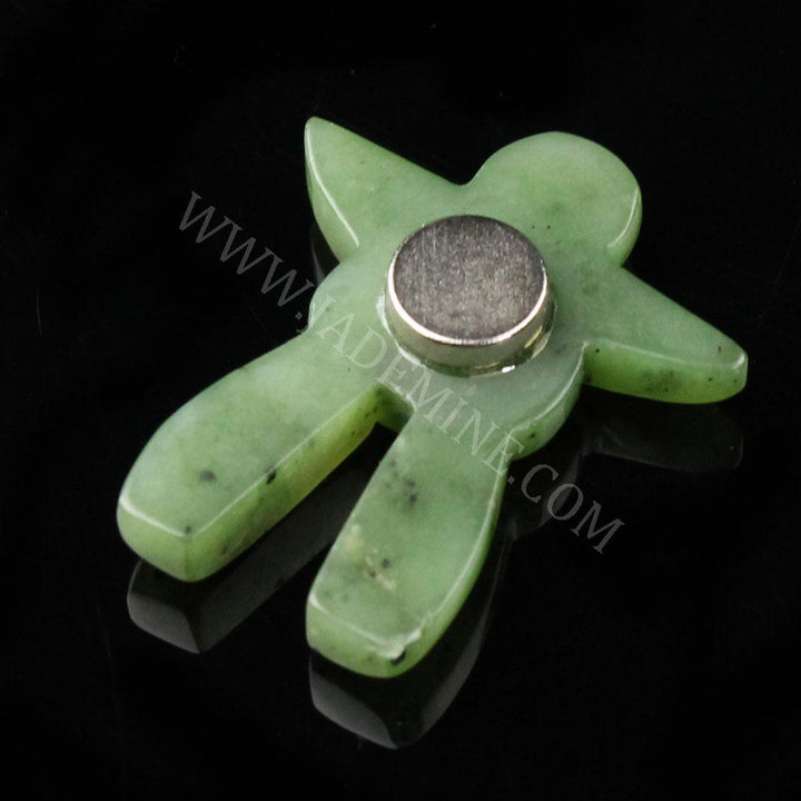 Green jade Inukshuk shaped fridge magnet with a round metal magnet at its center