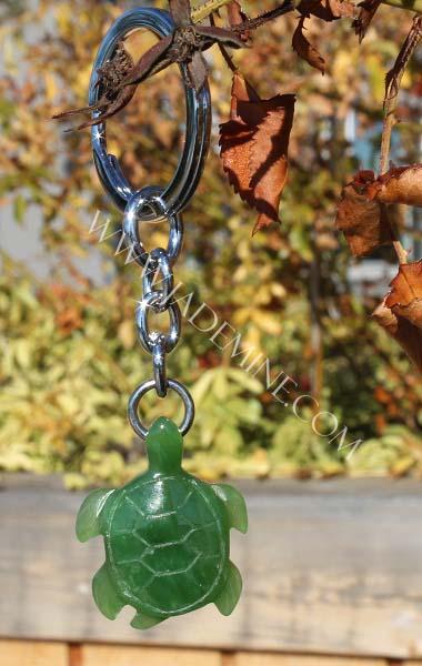 Green jade Turtle Keychain with fall leaves in the background