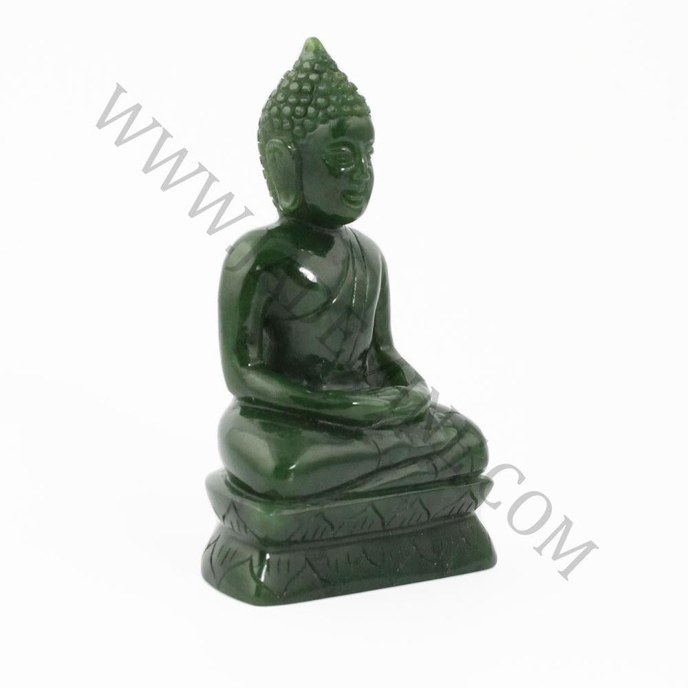Dark green jade Buddha statue seated in meditation on a layered base