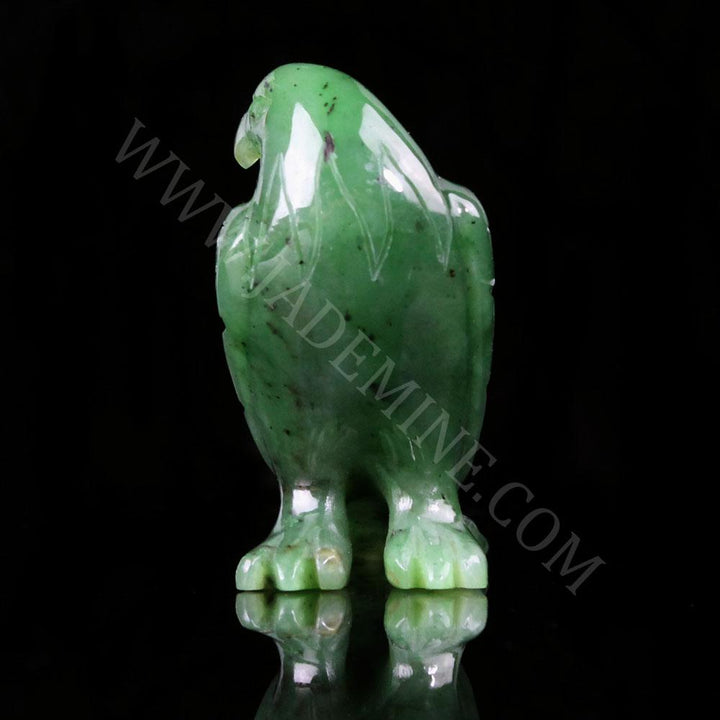 Green jade standing eagle from the back highlighting feather texture