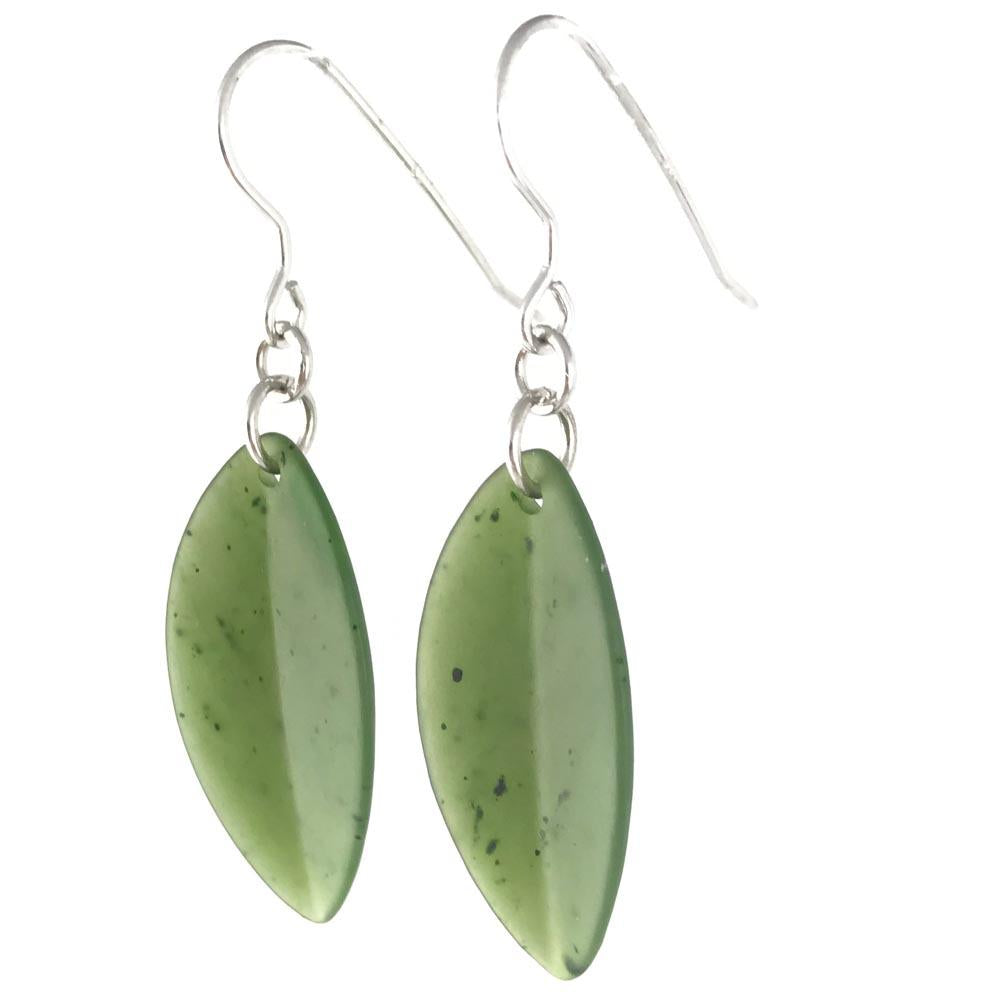 Close up of green leaf shaped gemstone earrings with silver ear wires