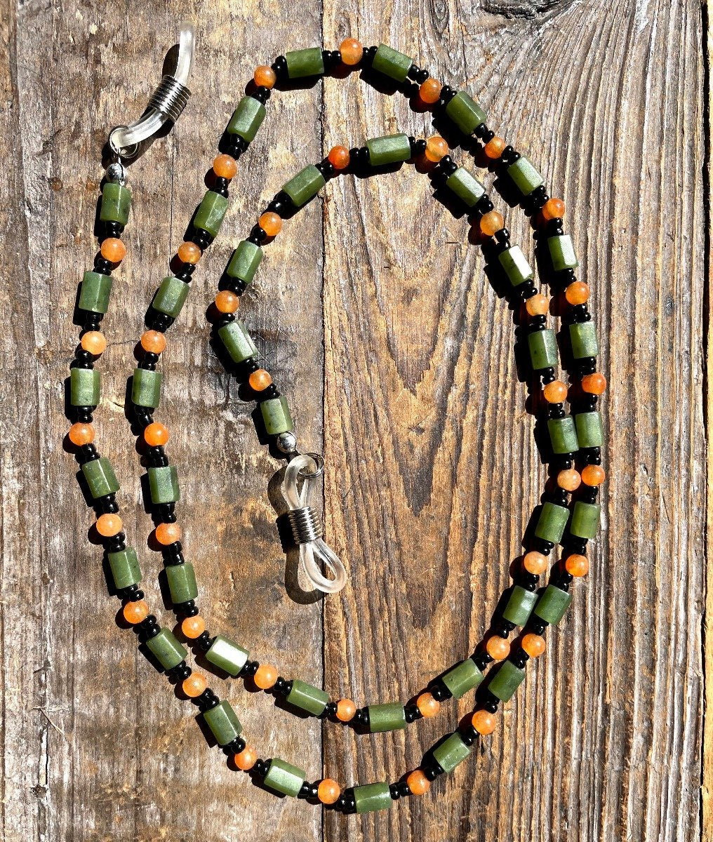 Jade and carnelian beaded eyeglass holder with orange round beads green cylinders and black spacers with clear loops