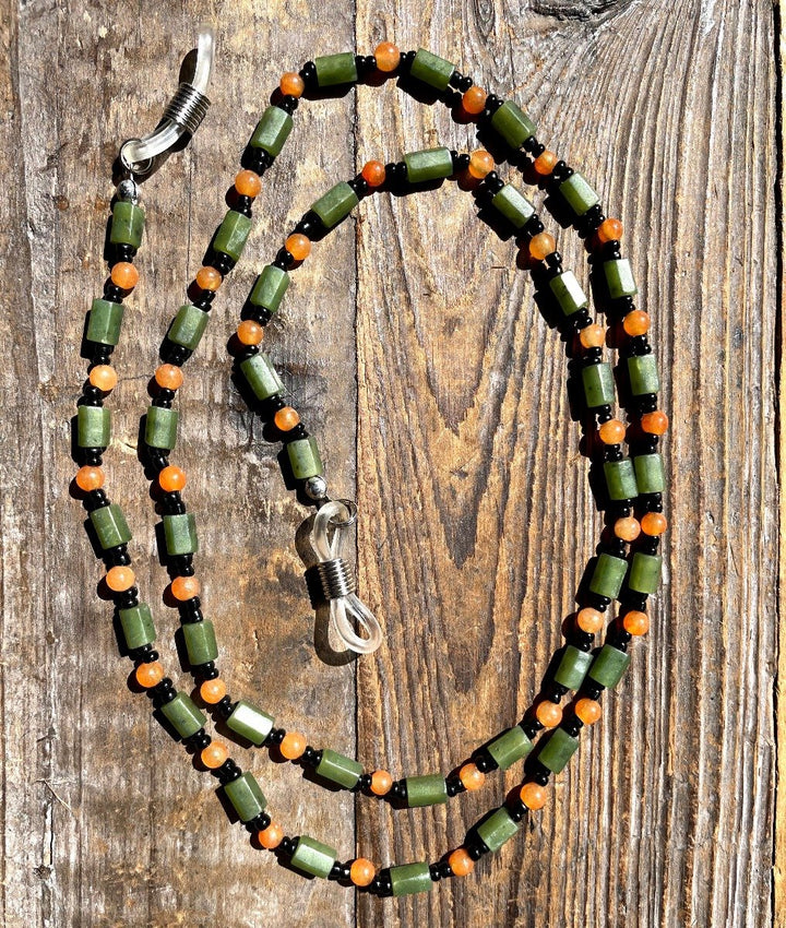 Jade and carnelian beaded eyeglass holder with orange round beads green cylinders and black spacers with clear loops