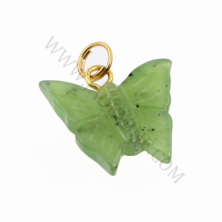 Close up of green jade butterfly charm with gold bail showing carved details