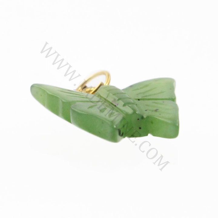 Green butterfly shaped jade charm with a small gold jump ring