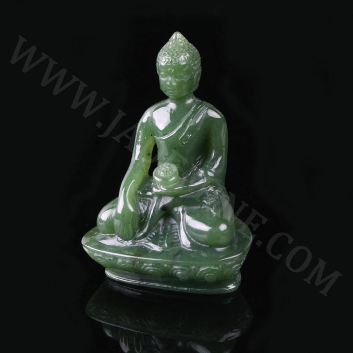 Green jade Buddha statue in a three quarter view seated in meditation with robe over the left shoulder on a decorative base