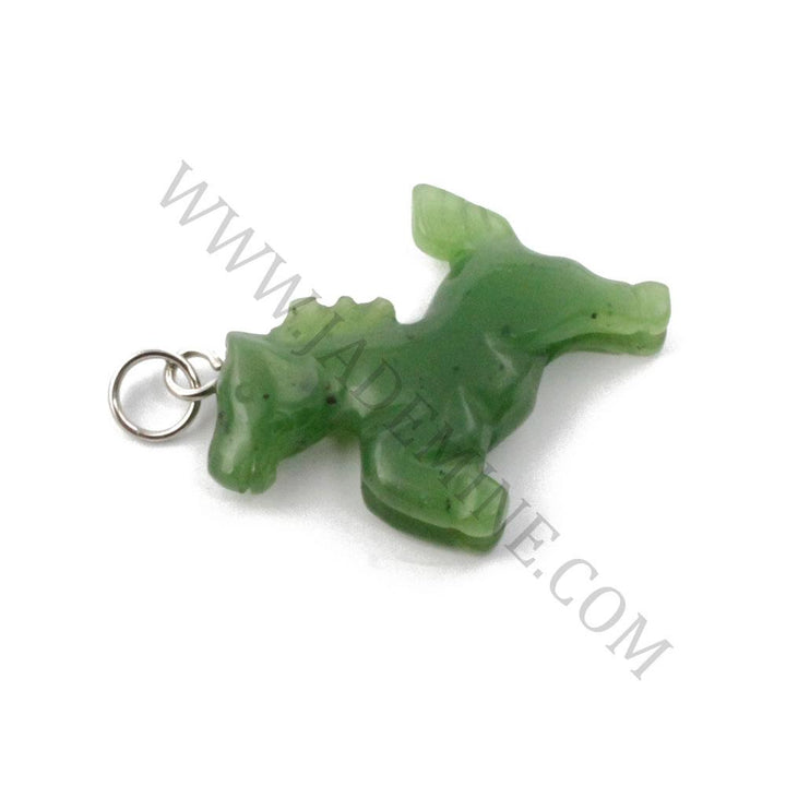 Green jade horse charm with a silver ring bail lying on a white background