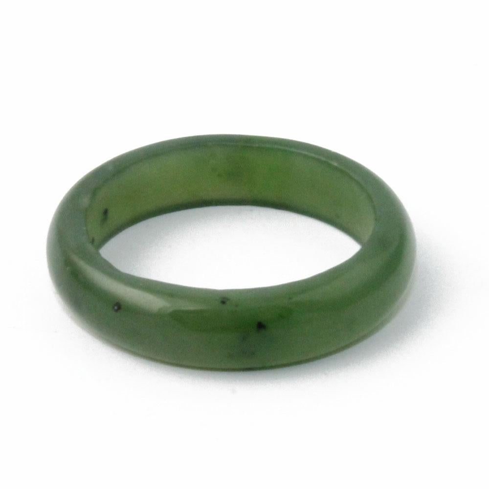Close up of a 5mm narrow green jade band ring